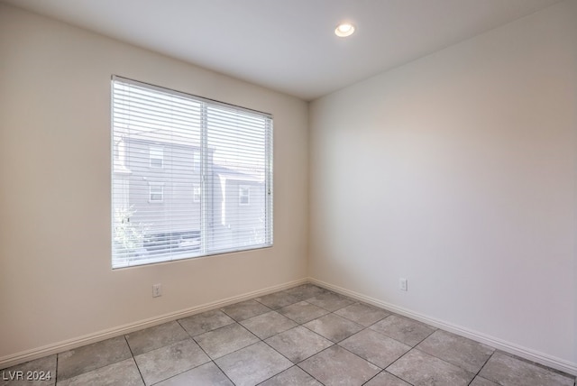 tiled empty room with a healthy amount of sunlight