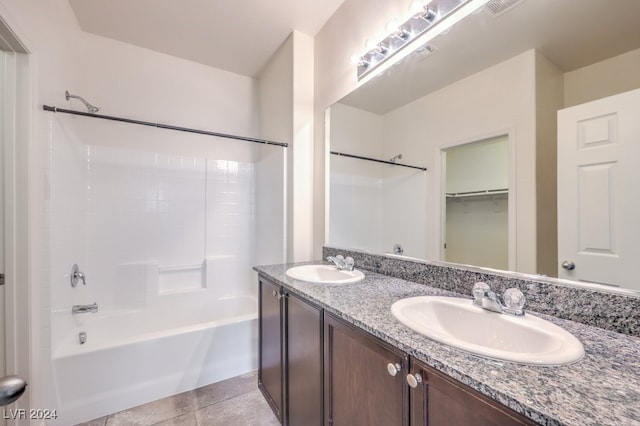 bathroom with tile patterned flooring, vanity, and shower / bathing tub combination