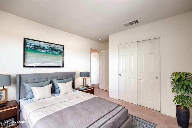 bedroom with carpet flooring and a closet