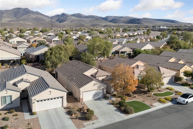 birds eye view of property with a mountain view