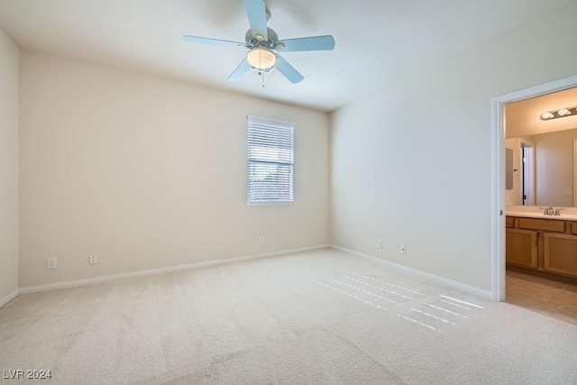 62 Augusta Course Ave, Las Vegas, NV 89148 - unfurnished bedroom with light carpet, ensuite bathroom, and ceiling fan