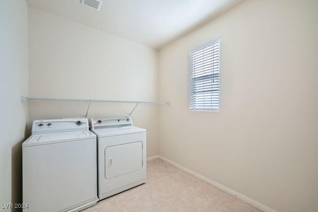62 Augusta Course Ave, Las Vegas, NV 89148 - laundry area with washing machine and clothes dryer and light tile patterned floors