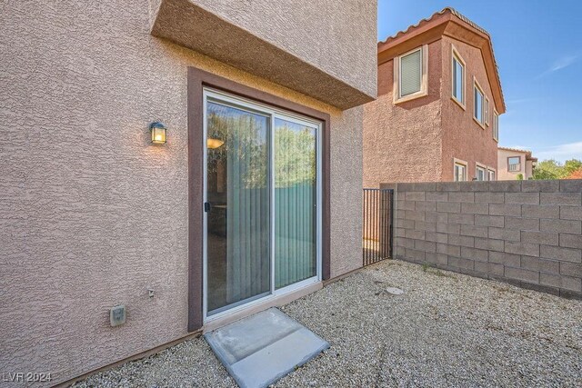 62 Augusta Course Ave, Las Vegas, NV 89148 - doorway to property featuring stucco siding and a tiled roof