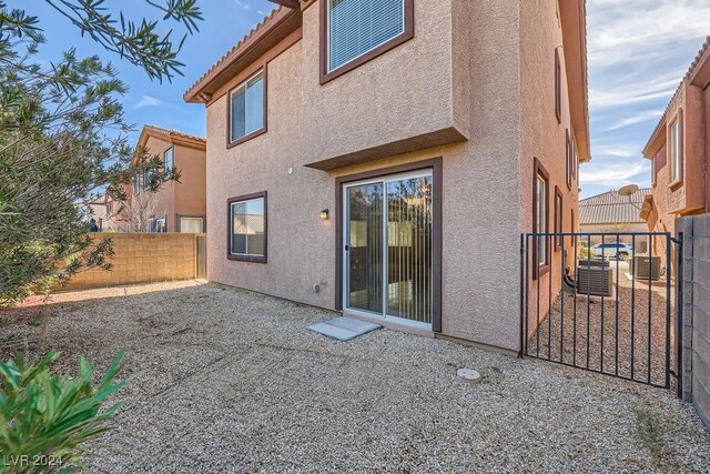 62 Augusta Course Ave, Las Vegas, NV 89148 - back of property featuring stucco siding, a fenced backyard, a patio area, and a tiled roof