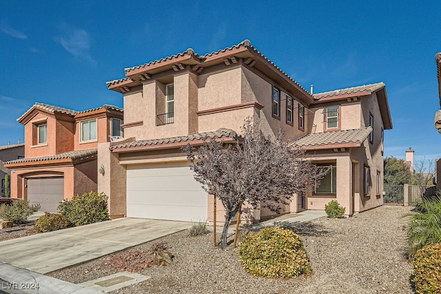 mediterranean / spanish-style house featuring a garage