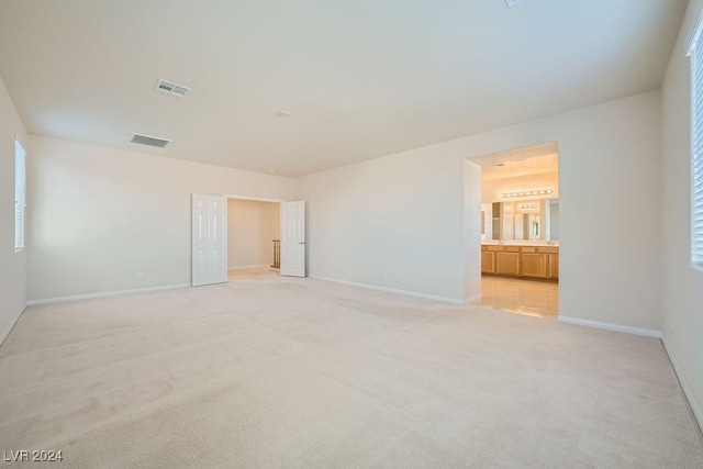 62 Augusta Course Ave, Las Vegas, NV 89148 - unfurnished bedroom with light colored carpet and ensuite bathroom