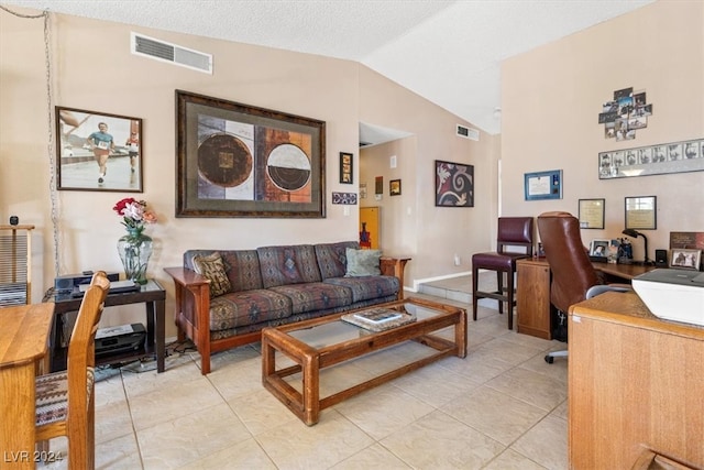 tiled living room featuring vaulted ceiling