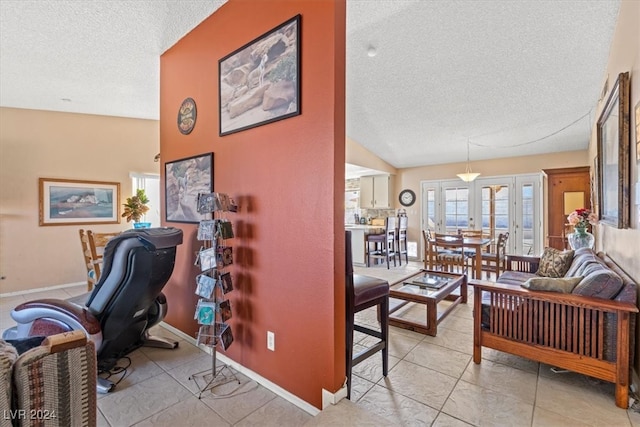 office area featuring french doors, a textured ceiling, and lofted ceiling