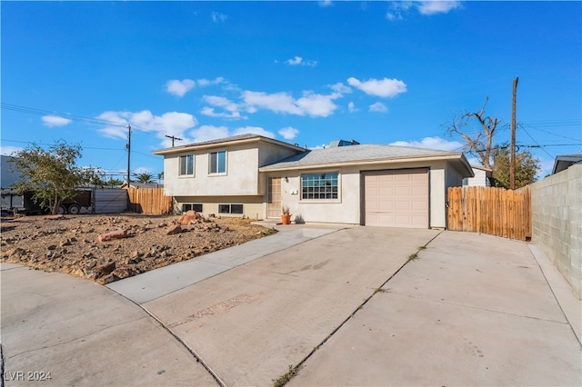 split level home featuring a garage