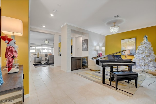 miscellaneous room with light tile patterned floors, crown molding, beverage cooler, and an inviting chandelier