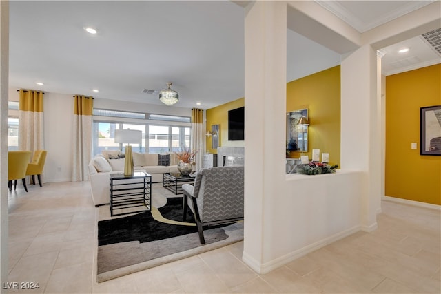 living room featuring crown molding and light tile patterned flooring