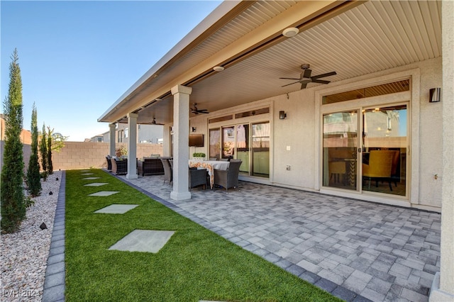 view of patio with outdoor lounge area and ceiling fan