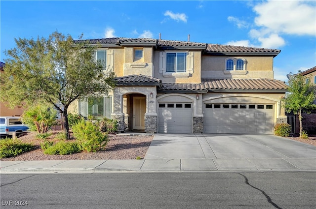 mediterranean / spanish-style house featuring a garage