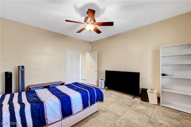 bedroom featuring ceiling fan and light tile patterned floors