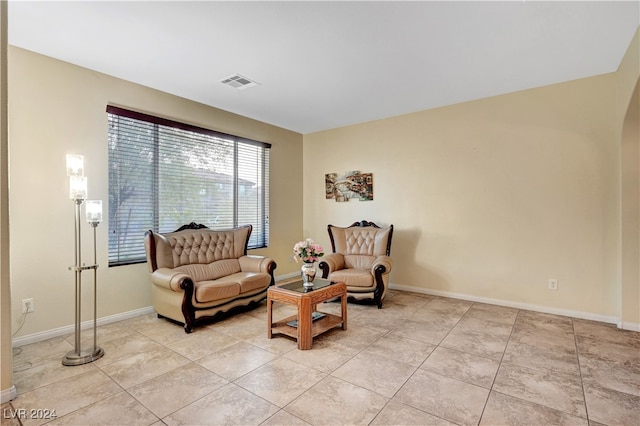 sitting room featuring light tile patterned flooring