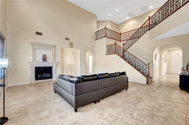 living room featuring a high ceiling