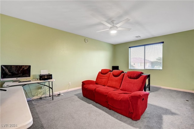 carpeted living room with ceiling fan