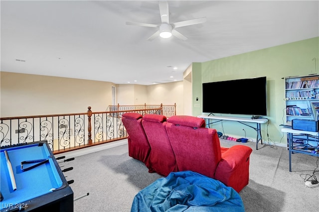 interior space featuring light colored carpet and ceiling fan