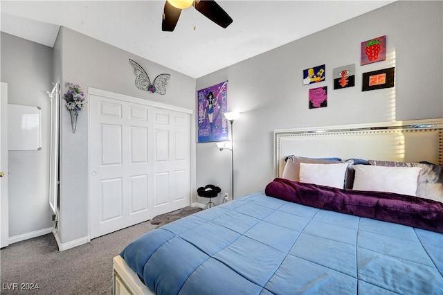 carpeted bedroom featuring a closet, vaulted ceiling, and ceiling fan