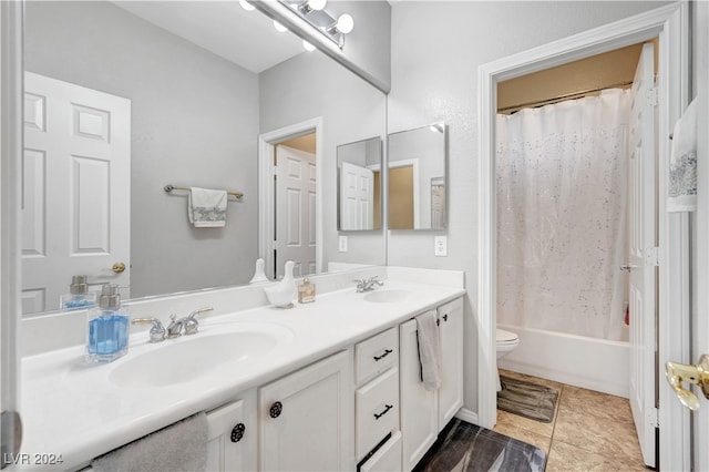 full bathroom with tile patterned floors, vanity, toilet, and shower / bath combo with shower curtain