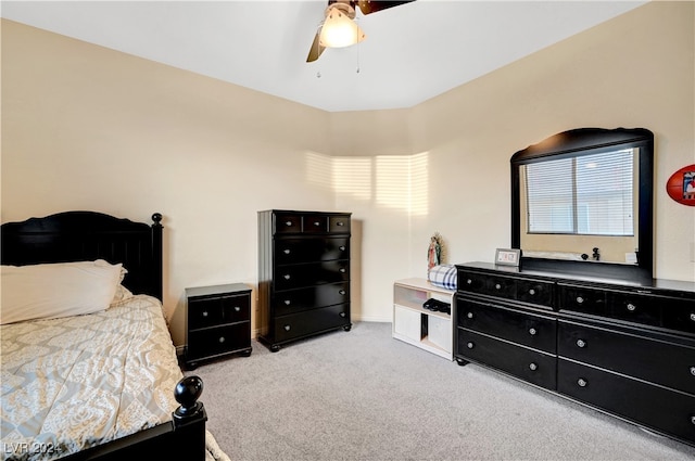 bedroom featuring ceiling fan and light carpet