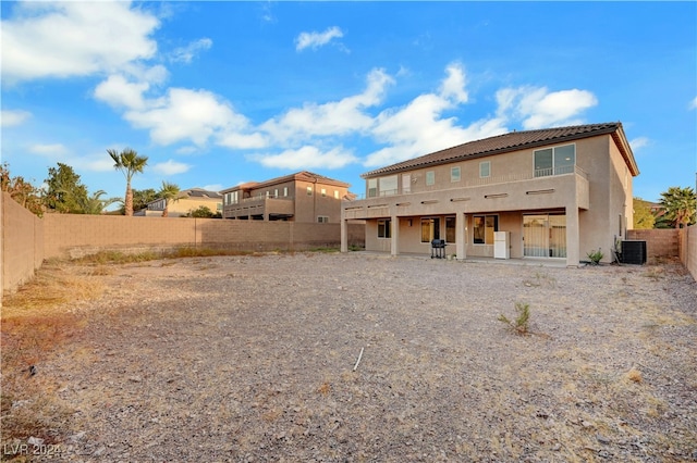 rear view of property with central air condition unit