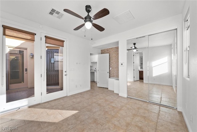 unfurnished bedroom with ceiling fan and light tile patterned flooring