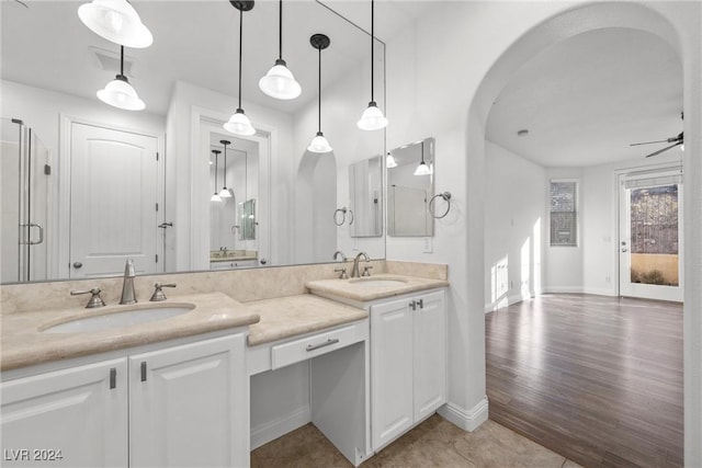 bathroom featuring hardwood / wood-style floors, vanity, and ceiling fan