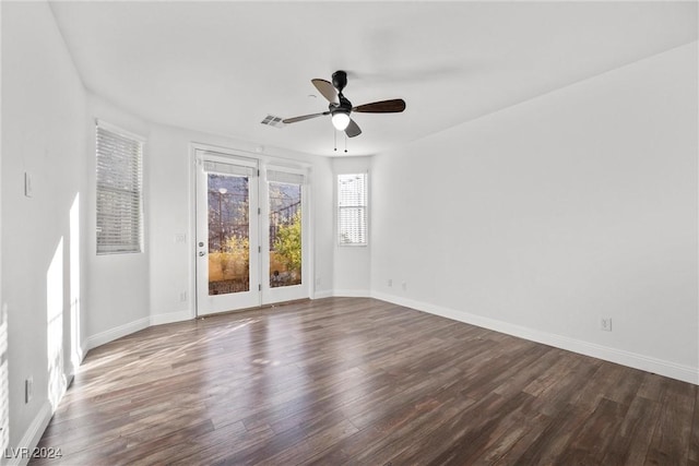 empty room featuring dark hardwood / wood-style floors and ceiling fan