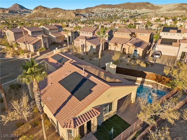 birds eye view of property featuring a mountain view