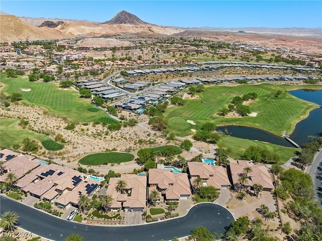 aerial view featuring a water and mountain view