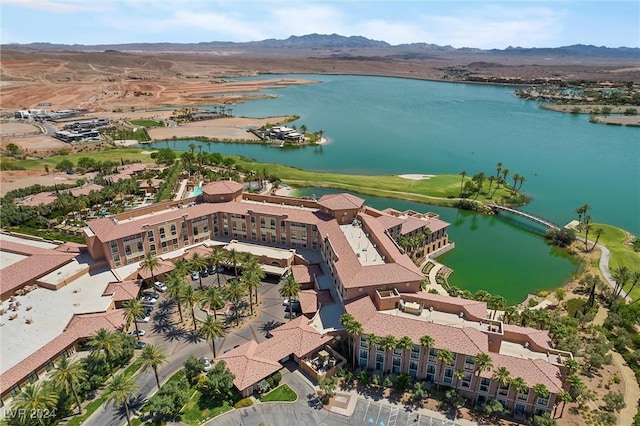 drone / aerial view featuring a water and mountain view