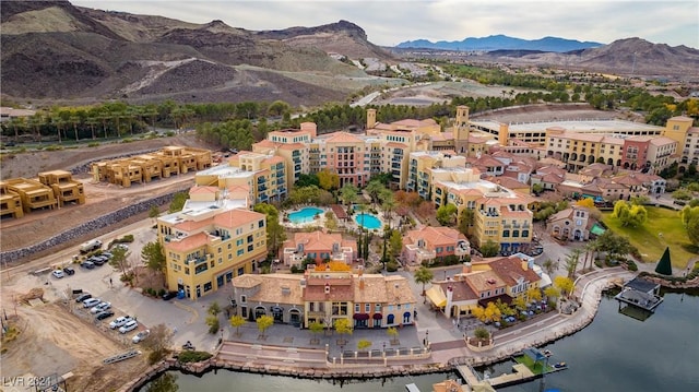 aerial view featuring a water and mountain view