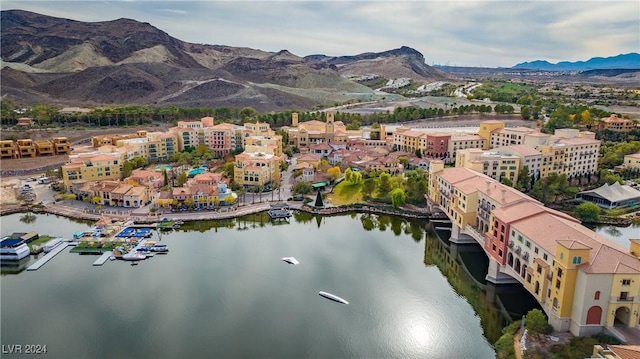 bird's eye view with a water and mountain view