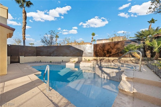 view of swimming pool with a patio area