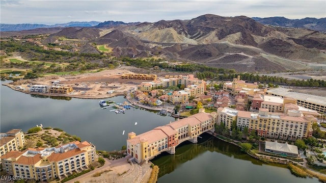 aerial view featuring a water and mountain view