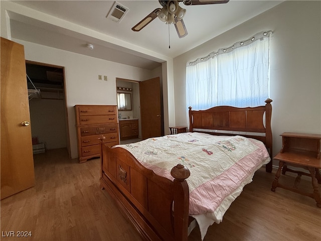 bedroom featuring a closet, ceiling fan, and light hardwood / wood-style flooring