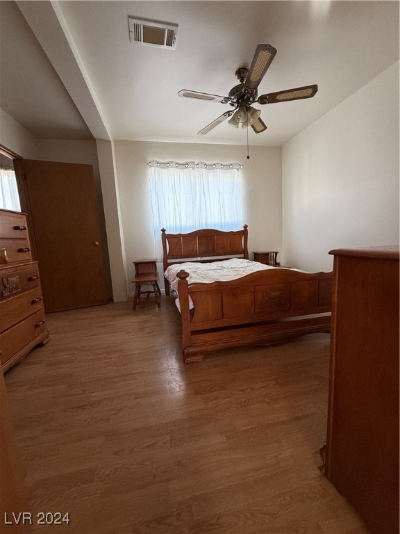 bedroom featuring hardwood / wood-style floors and ceiling fan