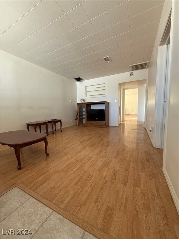 unfurnished living room with a fireplace and hardwood / wood-style flooring