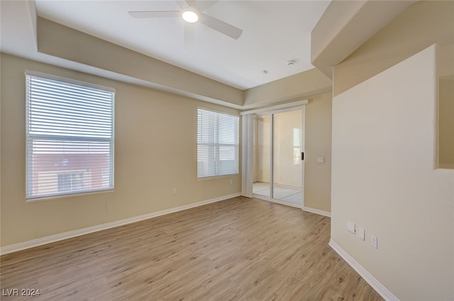 unfurnished room featuring light hardwood / wood-style floors and ceiling fan