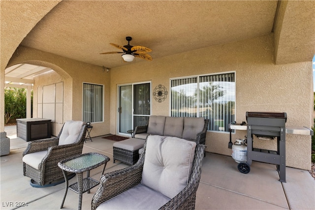 view of patio featuring ceiling fan