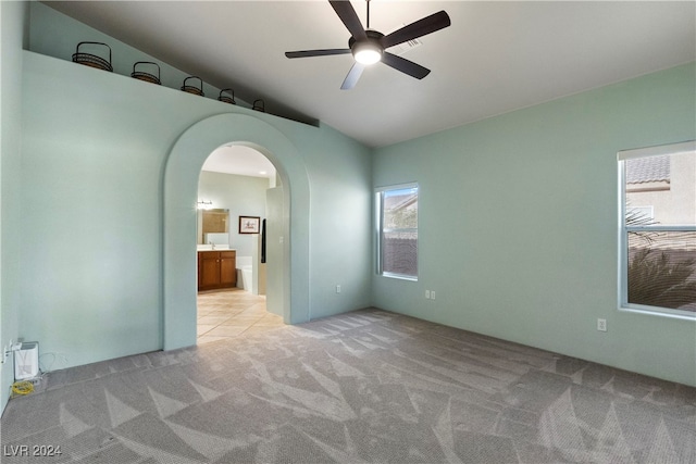 carpeted empty room with ceiling fan