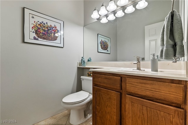 bathroom featuring tile patterned flooring, vanity, and toilet