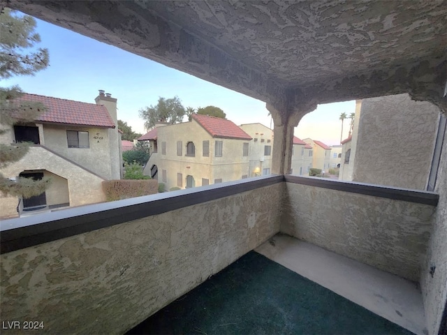 view of balcony at dusk