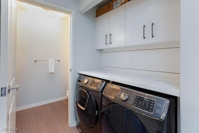 8255 Las Vegas Blvd Unit 2002, Las Vegas, NV 89123 - laundry area with separate washer and dryer, light wood-style floors, baseboards, and cabinet space