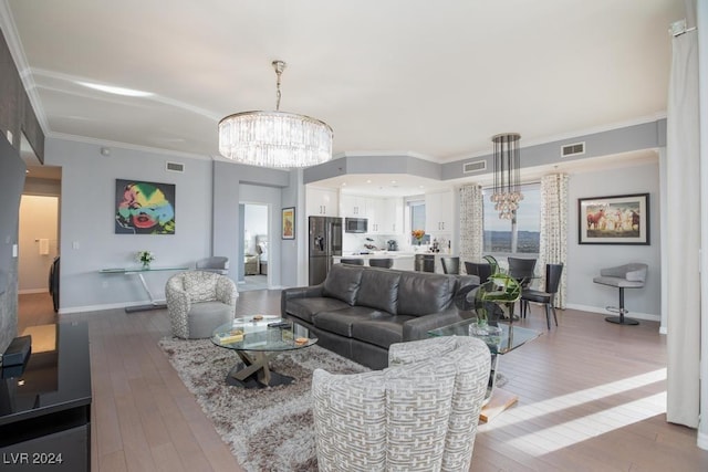 8255 Las Vegas Blvd Unit 2002, Las Vegas, NV 89123 - living room with a chandelier, hardwood / wood-style floors, baseboards, and crown molding