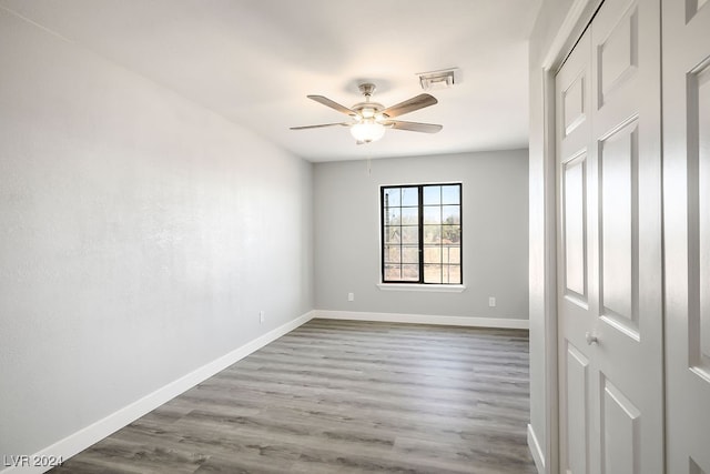 spare room with ceiling fan and hardwood / wood-style floors