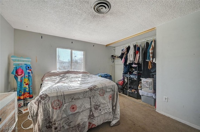 bedroom featuring carpet, a textured ceiling, and a closet