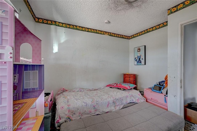 bedroom featuring a textured ceiling