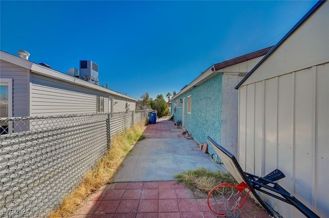 view of side of property with a patio area